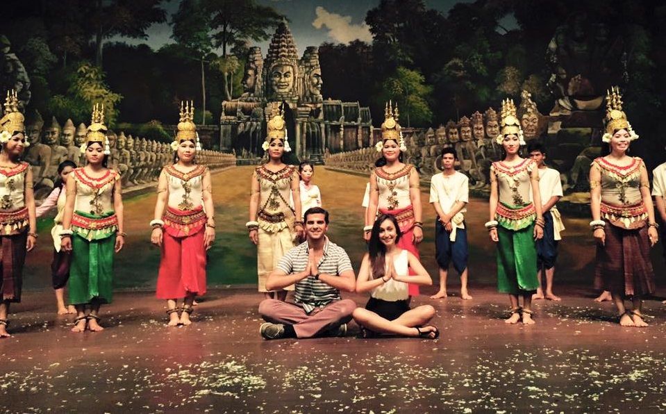 Students sitting in front of traditional dancers