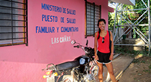 Lynsa Nguyen posing with a motorbike in Nicaragua